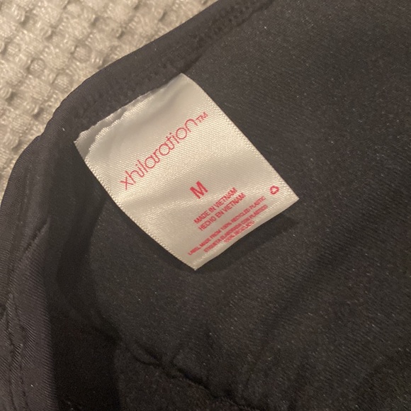 One piece black bathing suit.  High legged on bottom - Picture 4 of 5